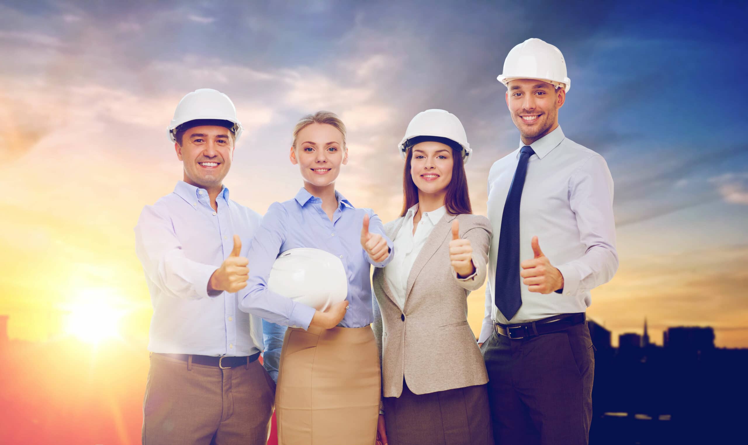 business, architecture and building concept - happy team of architects in white hard hats showing thumbs up over city background