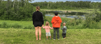Family looking over a pond